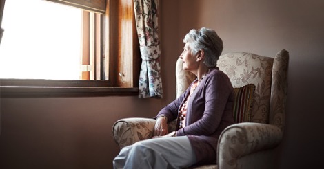 Lady sitting alone at a window