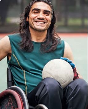Man with a smile in a wheelchair