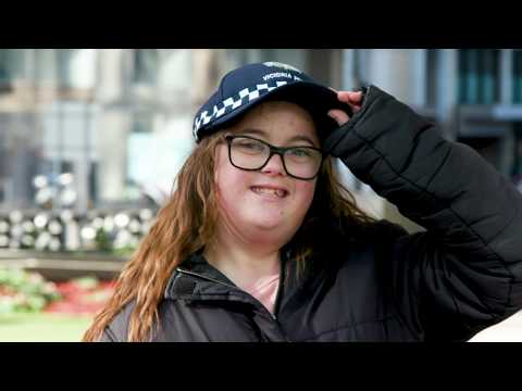 Young lady wearing a police hat