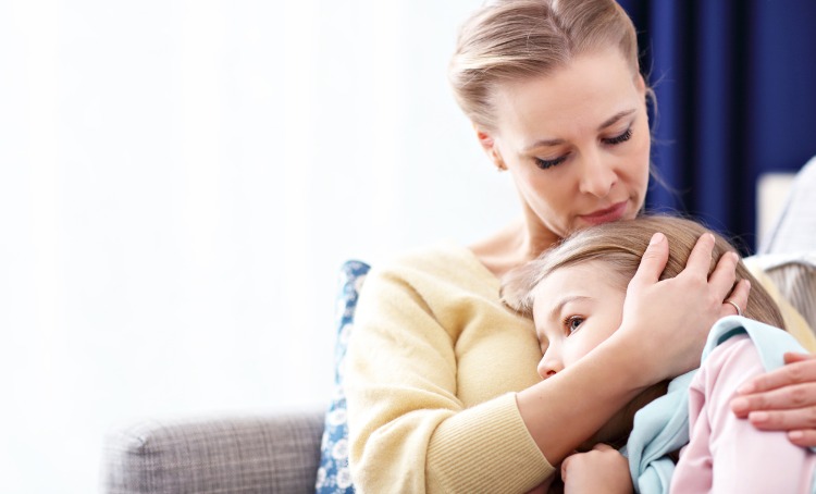 Little girl being comforted by her Mum 750