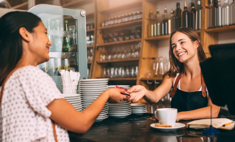 Paying for her own coffee