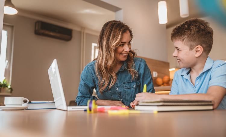 Speech therapist with a young boy 750