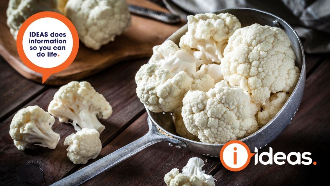 Fresh and chopped up cauliflower in a ladle and on aon a hessian mat