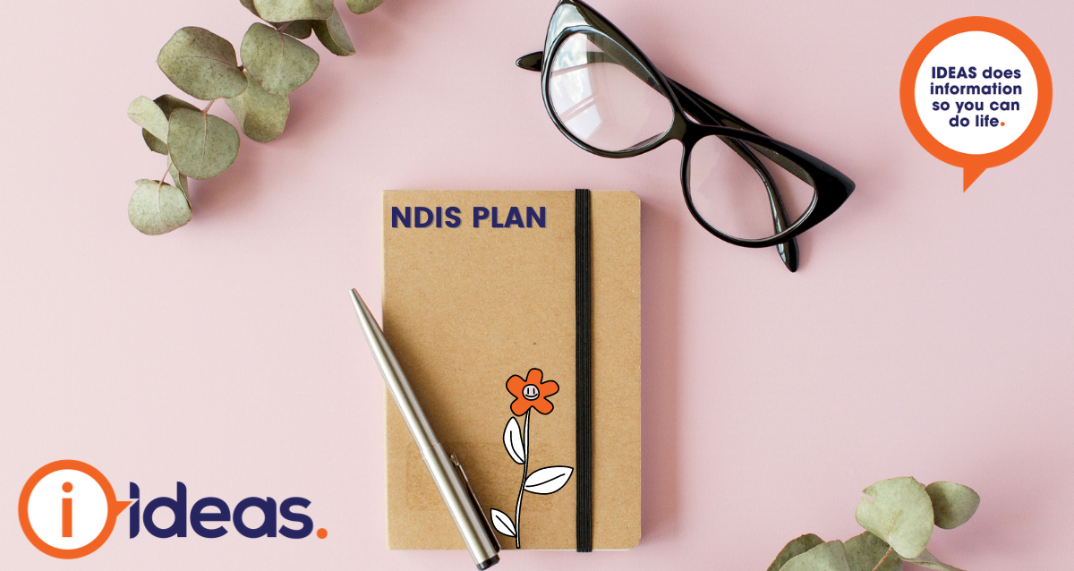 notebook on pink background with NDIS PLAN written on front. A ballpoint pen is on top of the diary with a pair of glasses in the right corner of image. Surrounded by two plants and IDEAS logo.