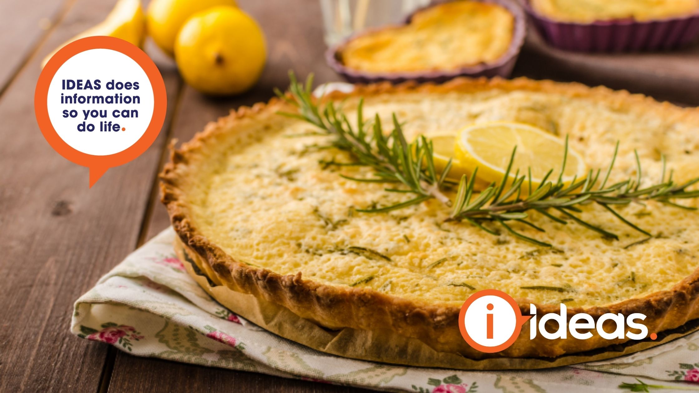 rosemary cake with sprigs of romsemary and slices of lemon