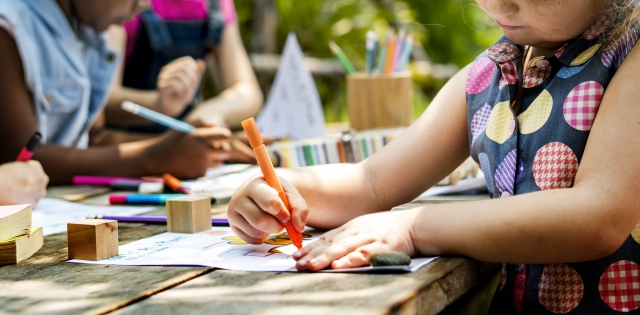 2018.11.08 Stock Photo Outside Young child colouring in a picture 001