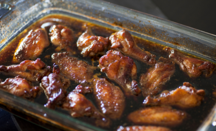 Chicken wings in glass tray