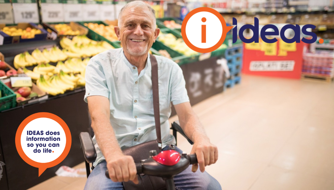 A man in a mobility scooter is grocery shopping