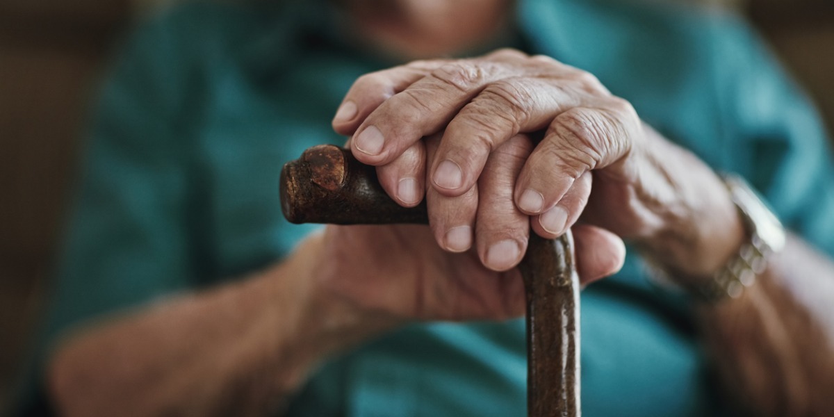 Senior with a walking stick