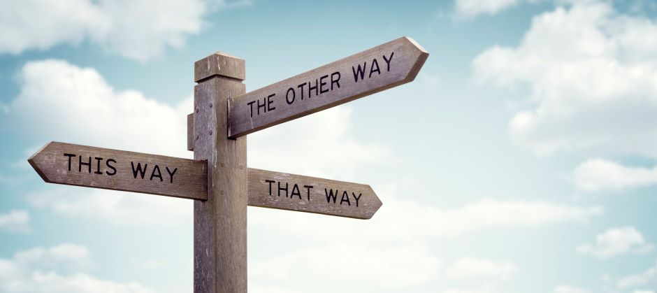 A road sign with 3 directions, this way. that way, the other way.