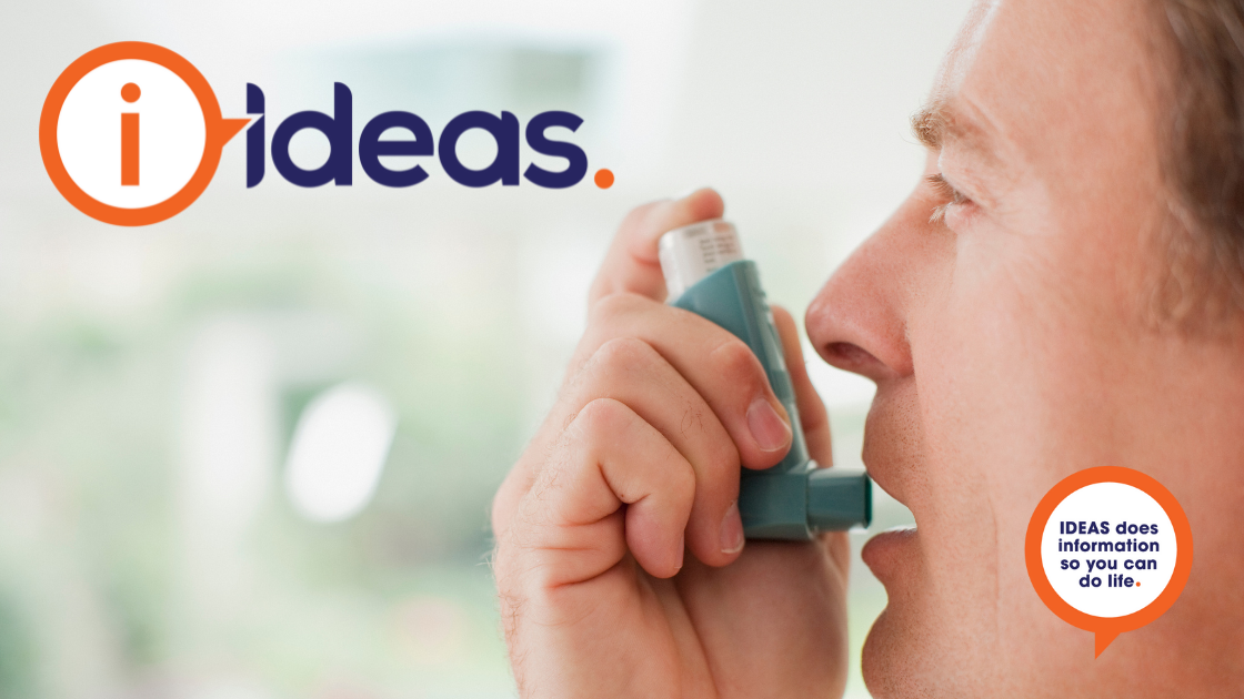 A man in profile holds an asthma reliever close to his mouth.