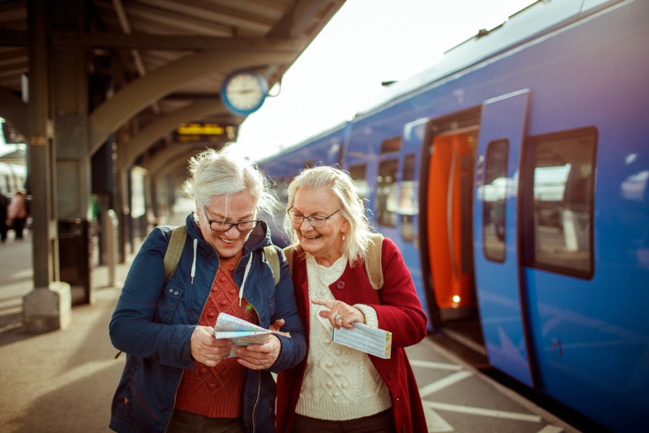 Two elderly women at a train station