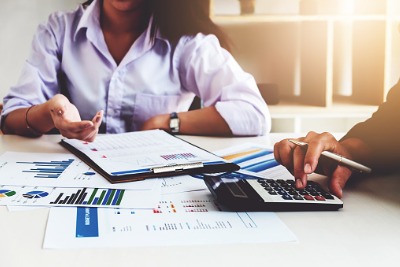 Professionals working with paper work and calculator