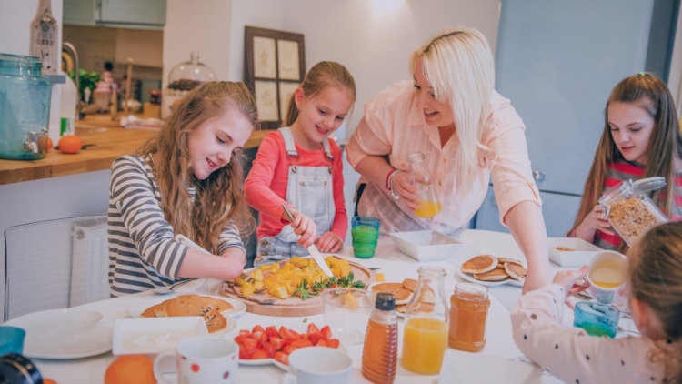 Family of girls preparing food picture. 