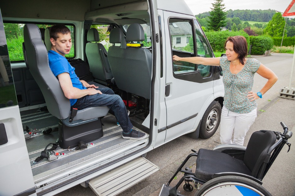 Boy with a disability in a school bus