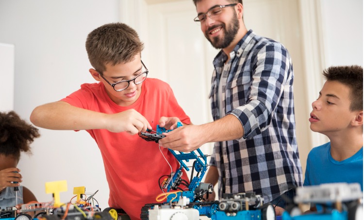 kids working on a robot design