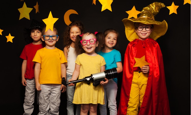 six kids in stargazers costumes with telescope picture about drama