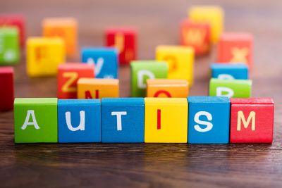 Colourful alphabet blocks which spell out "autism".