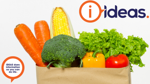 An image of a paper bag with vegetables. A concept photo of a food hamper.