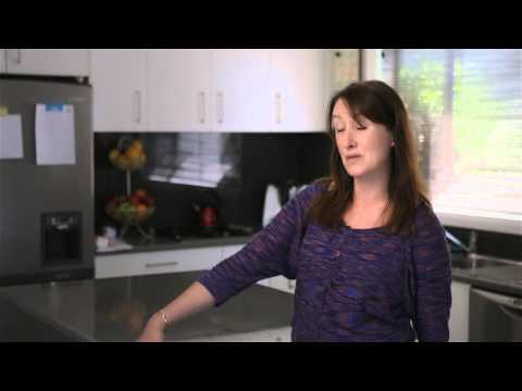 Lady standing in kitchen