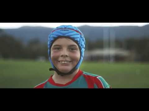 Young boy with a football helmet on