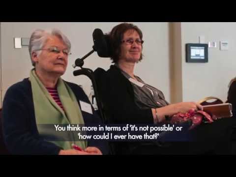 Mother sitting next to her daughter who is in a wheelchair