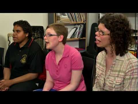 3 woman sitting and singing