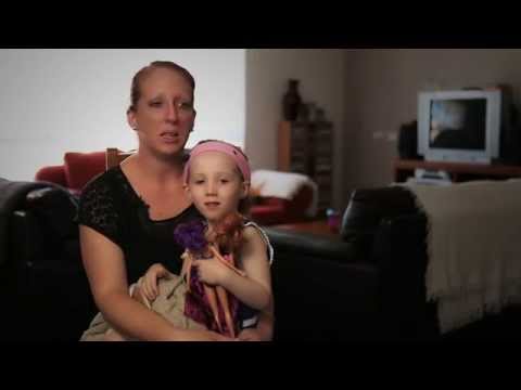 Mom with young daughter sitting on he lap