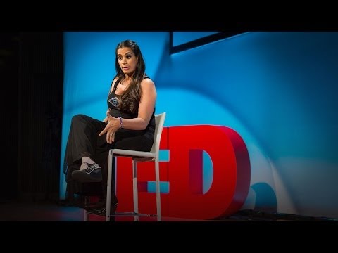 Lady sitting on a stool on stage