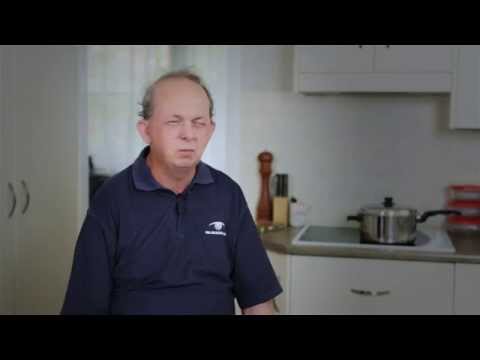 Man sitting in kitchen