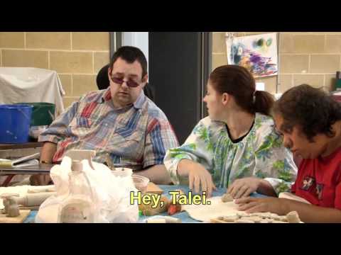 3 people working at a table