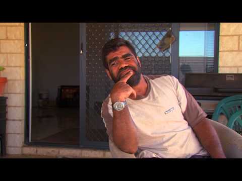 Man sitting on his back verandah 