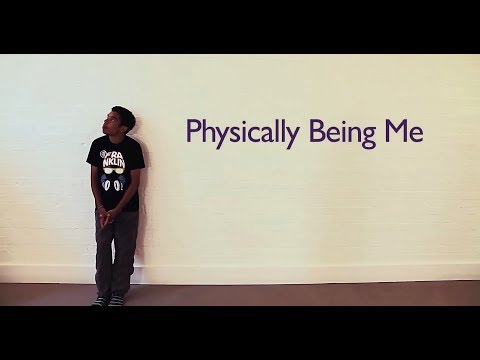 Young man leaning against a wall