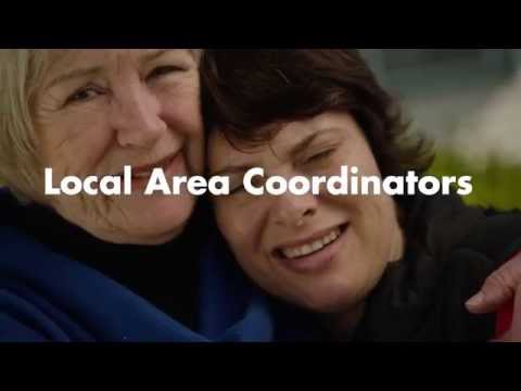 Two ladies hugging with Local Area Coordinators written across the screen