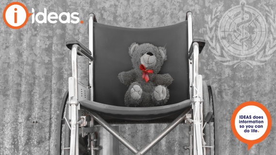 black and white image of wheelchair against Iron background. A teddy bear with a red bow is on the wheelchair with the World Health Organisation logo in the upper right corner.