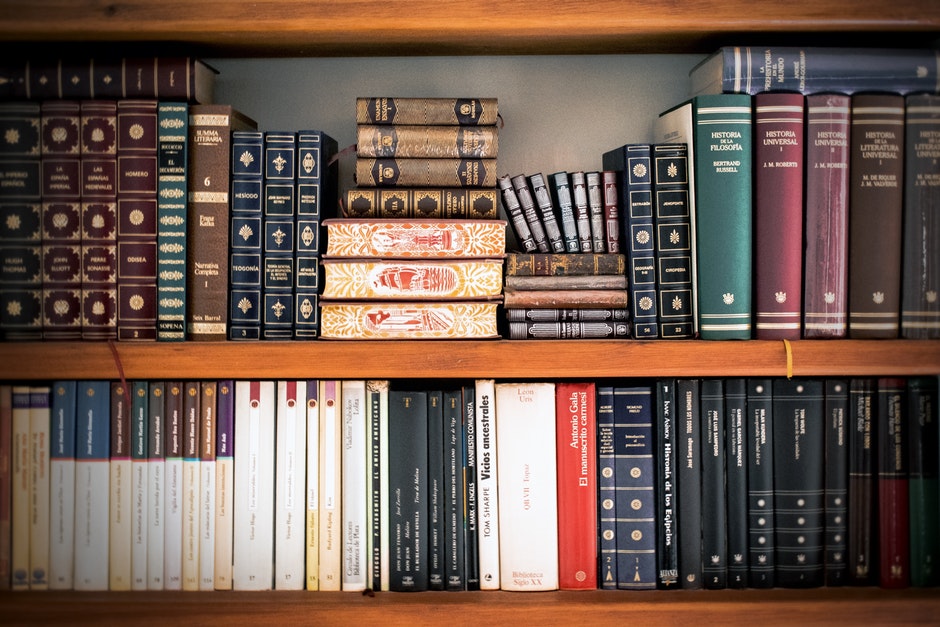 Image of bookshelves filled with leather-bound and gilded books