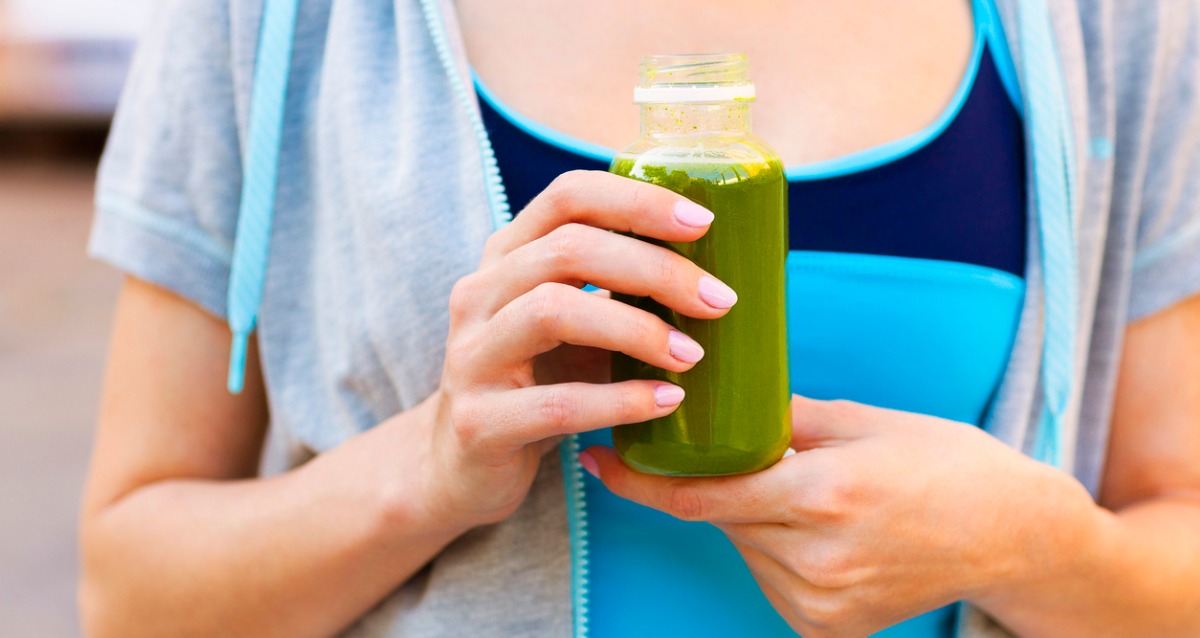 woman drinking vegetable smoothie