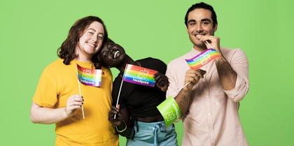 3 people from diverse backgrounds holding headspace rainbow flags