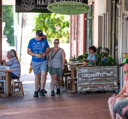 Dan walking past a cafe-cropped