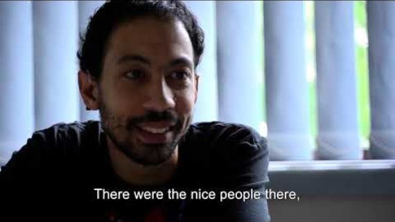 Man sitting by a window