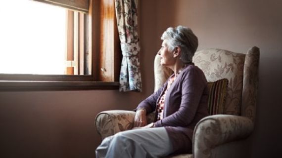 Lady sitting alone at a window