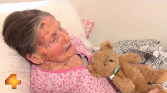 Elderly lady laying in bed