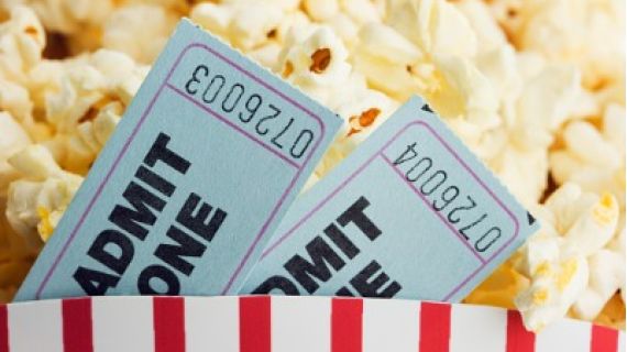 Image of popcorn and two movie tickets