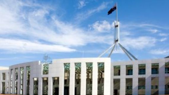 Exterior shot of Parliament House, Canberra with Australian Flag flying above