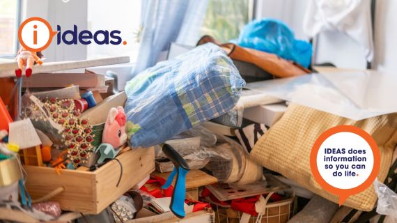 Image of clutter, boxes and bags overflowing with toys and papers