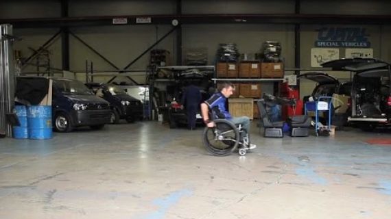 Man in a wheelchair in a workshop