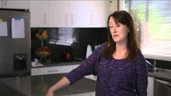 Lady standing in kitchen