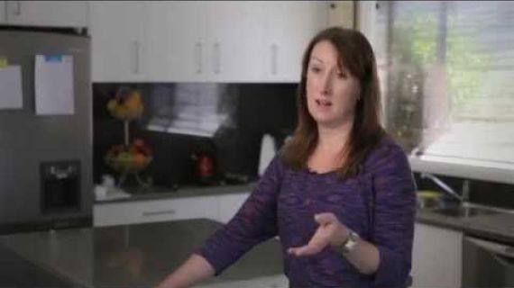 Lady standing in kitchen