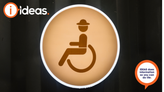 Wheelchair accessible toilet sign on black background
