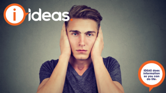 Image of a young man with his hands placed over his ears